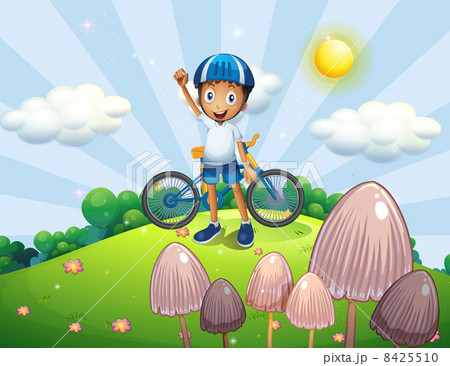 A male biker at the top of the hill 8425510