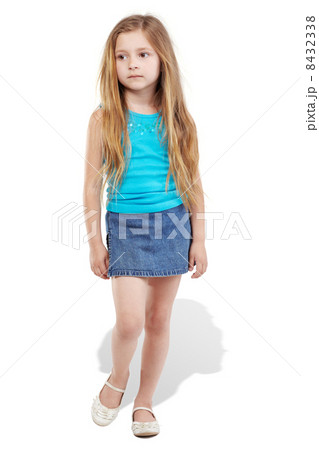 Walking girl poses for camera Walking girl poses for camera 8432338