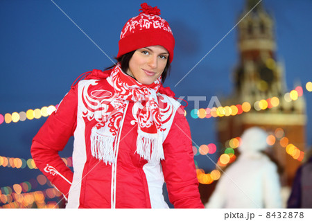 Happy girl in red at GUM-Skating rink on Red Square at evening i Happy girl in red at GUM-Skating rink on Red Square at evening i 8432878
