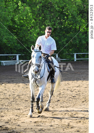 Jockey riding horse on hippodrome Jockey riding horse on hippodrome 8432953