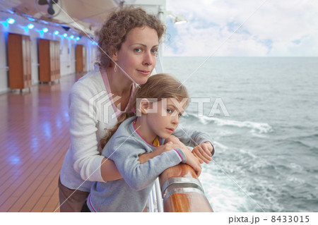 Mother hugging her daughter on board large passenger ship Mother hugging her daughter on board large passenger ship 8433015