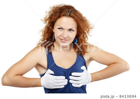 Woman with chestnut hair squeezes her breasts with her hands in 8433694