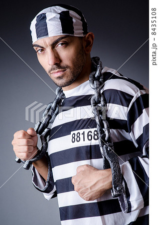 Convict criminal in striped uniform 8435108