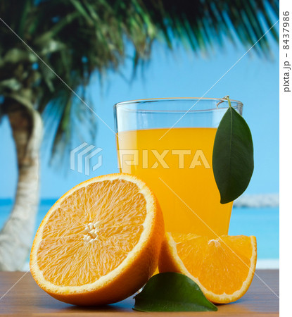 orange juice on a beach 8437986