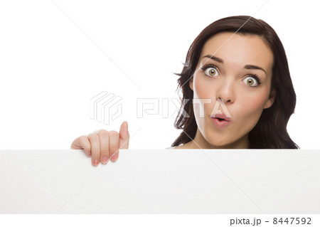 Wide Eyed Mixed Race Female Holding Blank Sign on White. Wide Eyed Mixed Race Female Holding Blank Sign on White. 8447592