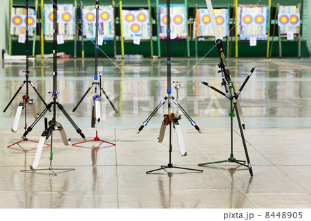 Five big sport bows stand on stilts inside shooting gallery 8448905