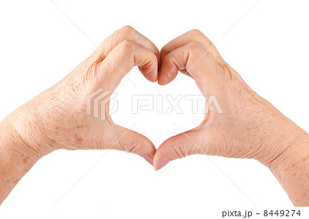 woman senior hands show heart gesture, isolated, white 8449274