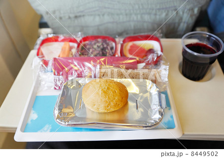 Bread, bun, cola in plastic cup, salad, carrots on salver Bread, bun, cola in plastic cup, salad, carrots on salver 8449502