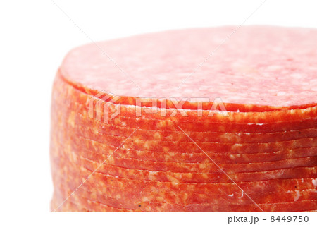 Close up of pink appetizing salami sausage pieces isolated on wh Close up of pink appetizing salami sausage pieces isolated on wh 8449750