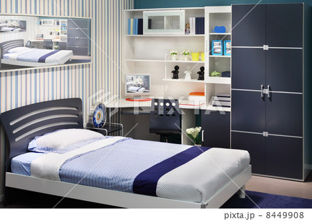 Simple white-blue children room with big bed and table for compu 8449908