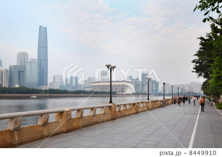 GUANGZHOU - NOVEMBER 22: People walk at embankment of Zhujiang R GUANGZHOU - NOVEMBER 22: People walk at embankment of Zhujiang R 8449910