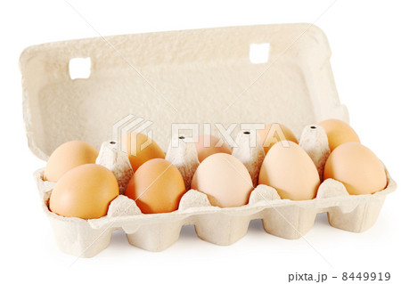 Close up of ten brown eggs in cardboard container isolated on wh Close up of ten brown eggs in cardboard container isolated on wh 8449919
