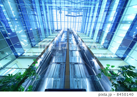 MOSCOW - DECEMBER 20: Two moving lifts in skyscraper North Tower MOSCOW - DECEMBER 20: Two moving lifts in skyscraper North Tower 8450140