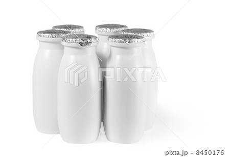 white plastic bottle with foil cap, date with yogurt stand on table white plastic bottle with foil cap, date with yogurt stand on table 8450176