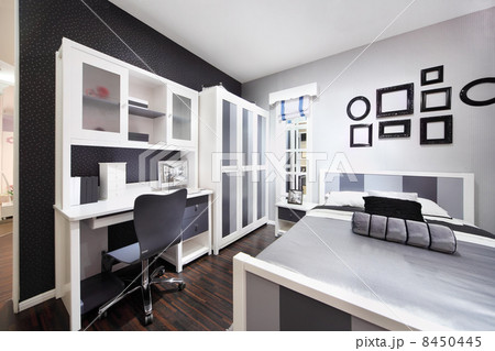 Stylish black-white bedroom with double bed, wardrobe and comput Stylish black-white bedroom with double bed, wardrobe and comput 8450445