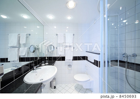 Stylish modern bathroom with shower, sink, toilet and white tile Stylish modern bathroom with shower, sink, toilet and white tile 8450693