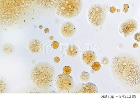 Abstract yellow bubbles of oil in water. 8451289