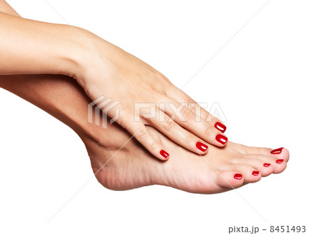 Closeup photo of a female feet with beautiful red pedicure Closeup photo of a female feet with beautiful red pedicure 8451493