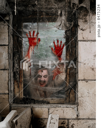 Hungry zombie at the window Hungry zombie at the window 8475234
