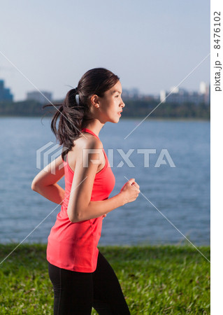 Asian Woman in Sportswear Running Asian Woman in Sportswear Running 8476102