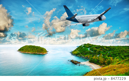 Jet is over the tropical resort in the morning 8477229