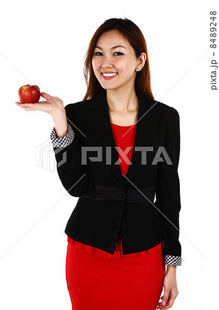 Portrait of young Asian business woman keeping finger on her lips and asking to keep quiet, on white 8489248