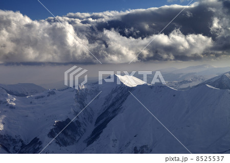 Winter mountains in evening and cloudy sky Winter mountains in evening and cloudy sky 8525537