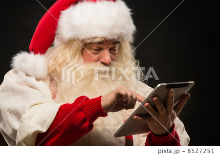 Santa Claus using tablet computer 8527251