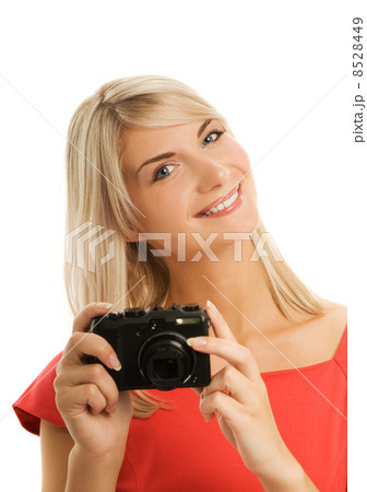 Beautiful smiling woman with digital camera. Isolated on white b 8528449