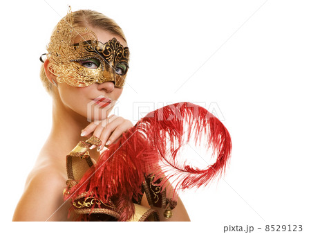 Beautiful young woman with carnival mask on her face 8529123
