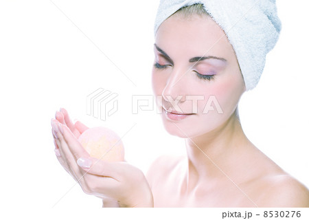 Lovely young woman with aroma bath ball in her hands. Toned in b Lovely young woman with aroma bath ball in her hands. Toned in b 8530276
