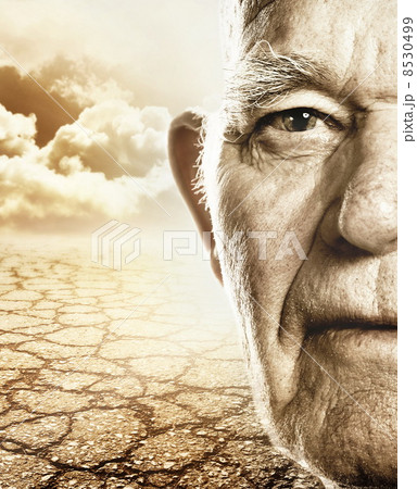 Elderly mans face over dry desert land background 8530499