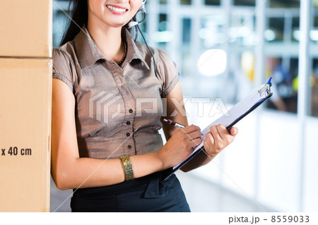 Customer Service in Asian logistics warehouse 8559033