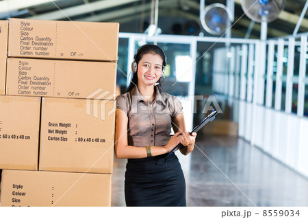 Customer Service in Asian logistics warehouse 8559034