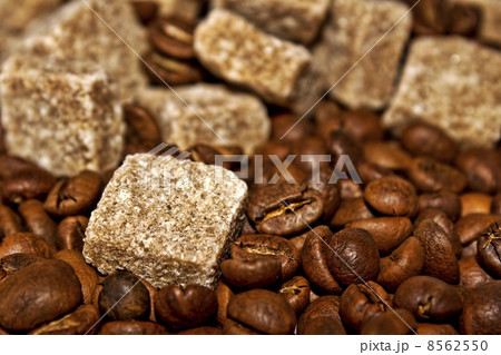 Grains of coffee and pieces of reed sugar Grains of coffee and pieces of reed sugar 8562550
