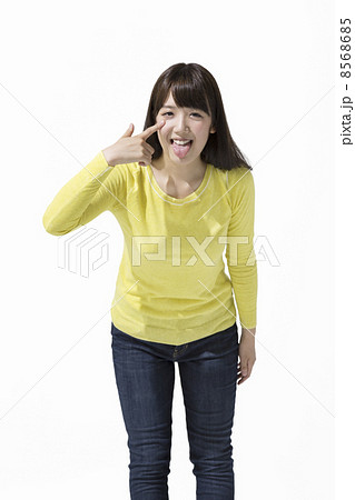 あっかんべーをする女性の写真素材
