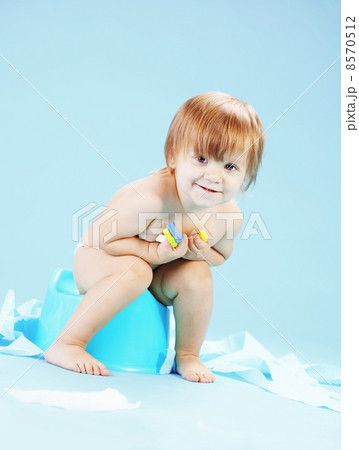 Cute toddler on potty chait 8570512