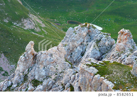 Rocky Mountains in Caucasus Landscape with green valley and lake on background Summer day 8582651
