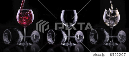 Elegant white wine glass in black background 8592207
