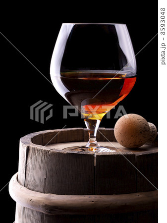 Cognac or brandy on a black 8593048