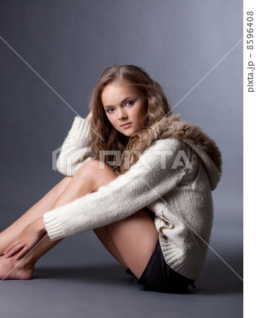 Smiling beautiful girl posing in casual clothes 8596408