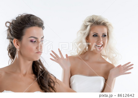 Portrait of emotional brides posing in studio Portrait of emotional brides posing in studio 8612642