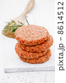 Raw burgers for hamburgers, in a pile 8614512