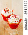 red festive muffins with heart candy and  wood 8614522