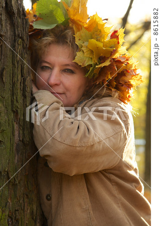 sad mature woman near tree 8615882