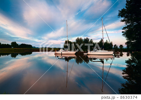 two yachts on river at sunrise 8630374