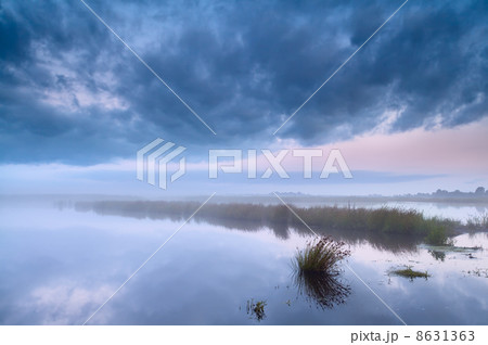 lake in fog at early morning 8631363