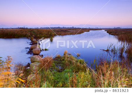 calm river at sunrise 8631923