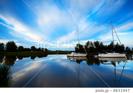 two yachts on blue river 8631947