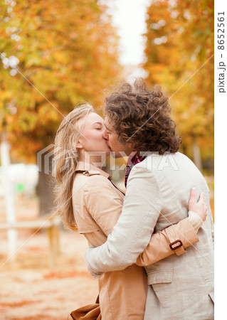 Romantic couple kissing on a fall day 8652561